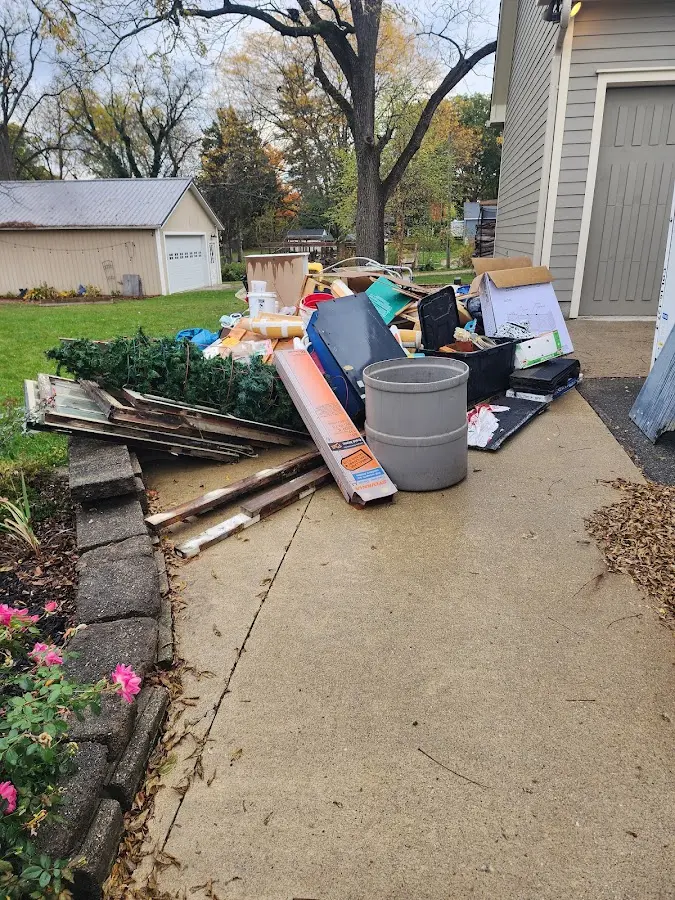 Dumpster being loaded with debris for 3 Yard Dumpster Rental in Odessa